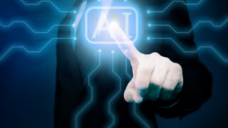 AIの文字に指さす近未来なイメージ